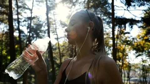 Stock Video Fitness Woman Drinking Water During Her Training Live Wallpaper For PC - Free Live Wallpaper