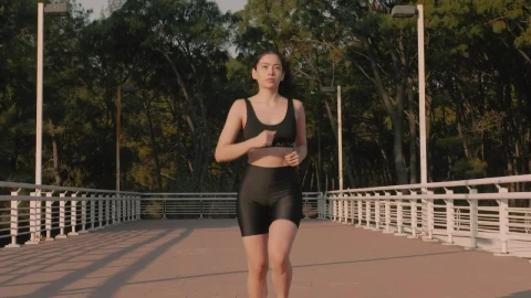 Stock Video Fit Woman From The Front Jogging Down The Street Live Wallpaper For PC - Free Live Wallpaper