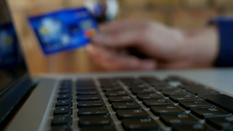 Stock Video Finger Typing And Unfocused Hand Holding Credit Card Live Wallpaper For PC - Free Live Wallpaper