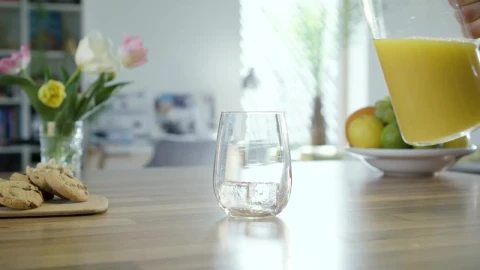 Stock Video Filling A Glass On The Table With Orange Juice Live Wallpaper For PC - Free Live Wallpaper