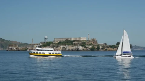 Stock Video Ferry And Sailboat Passing By Alcatraz Island In San Francisco Live Wallpaper For PC - Free Live Wallpaper