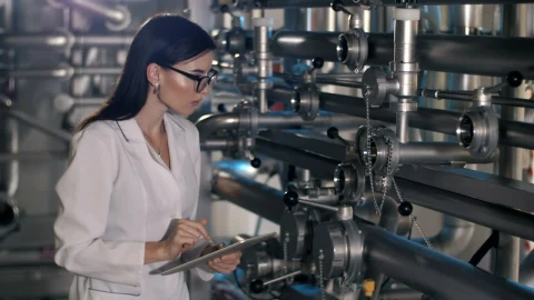 Stock Video Female Worker Checks Pressure Levels In Machines Live Wallpaper For PC - Free Live Wallpaper