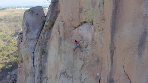 Stock Video Female Mountaineer Climbing On Top Of A Mountain Live Wallpaper For PC - Free Live Wallpaper