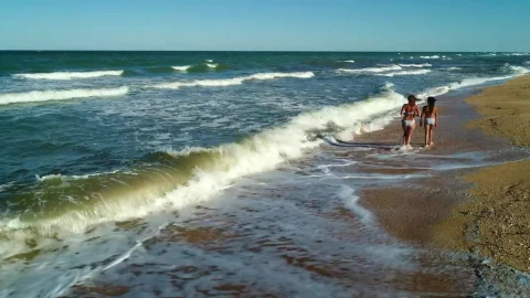 Stock Video Female Friends Strolling On The Seashore Live Wallpaper For PC - Free Live Wallpaper