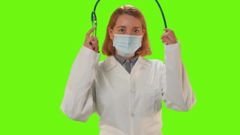Stock Video Female Doctor With Mask On A Green Background Live Wallpaper For PC - Free Live Wallpaper