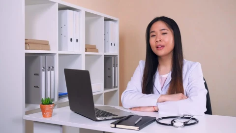 Stock Video Female Doctor In White Coat In Her Office Talking Live Wallpaper For PC - Free Live Wallpaper