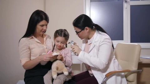 Stock Video Female Doctor Examining A Child Patient Live Wallpaper For PC - Free Live Wallpaper