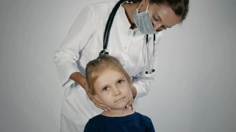 Stock Video Female Doctor Checking The Lymph Node Of The Child Live Wallpaper For PC - Free Live Wallpaper