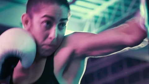 Stock Video Female Boxer Punching A Boxing Bag Live Wallpaper For PC - Free Live Wallpaper