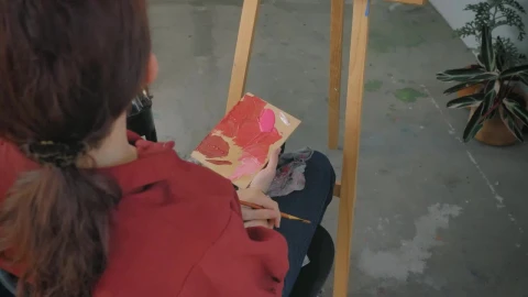 Stock Video Female Artist Painting A Picture In A Workshop Live Wallpaper For PC - Free Live Wallpaper