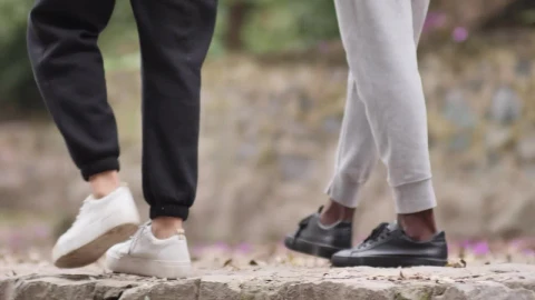 Stock Video Feet Of A Couple Of People Walking In A Park Live Wallpaper For PC - Free Live Wallpaper