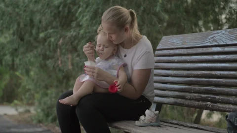 Stock Video Feeding Her Young Child A Yogurt Live Wallpaper For PC - Free Live Wallpaper