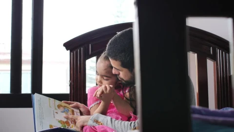 Stock Video Father With His Daughter In His Arms Reads A Childrens Live Wallpaper For PC - Free Live Wallpaper