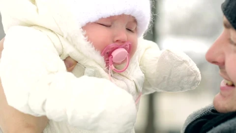 Stock Video Father Looking And Kissing His Baby In Winter Live Wallpaper For PC - Free Live Wallpaper