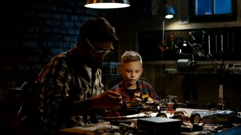 Stock Video Father And Son Repairing A Drone In The Garage Live Wallpaper For PC - Free Live Wallpaper