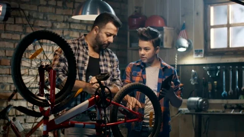 Stock Video Father And Son Repairing A Bike With Tutorial Live Wallpaper For PC - Free Live Wallpaper