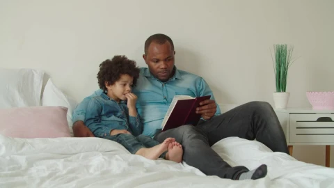 Stock Video Father And Son Reading A Book Together Live Wallpaper For PC - Free Live Wallpaper
