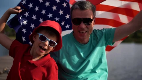 Stock Video Father And Son Celebrating With An American Flag Live Wallpaper For PC - Free Live Wallpaper