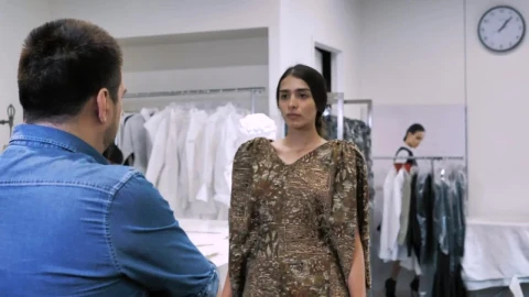 Stock Video Fashion Designer Fits A Brown Dress Live Wallpaper For PC - Free Live Wallpaper