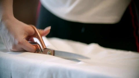 Stock Video Fashion Designer Cutting Fabric With A Scissor Live Wallpaper For PC - Free Live Wallpaper