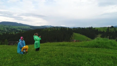 Stock Video Family Wearing Raincoats Taking Selfies In Nature Live Wallpaper For PC - Free Live Wallpaper