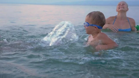 Stock Video Family Splashing In The Ocean Live Wallpaper For PC - Free Live Wallpaper
