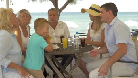 Stock Video Family Sitting At A Beach Table Live Wallpaper For PC - Free Live Wallpaper