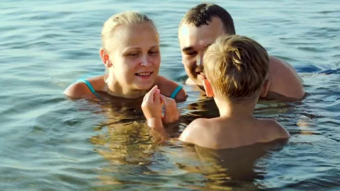 Stock Video Family Playing In Shallow Water Live Wallpaper For PC - Free Live Wallpaper