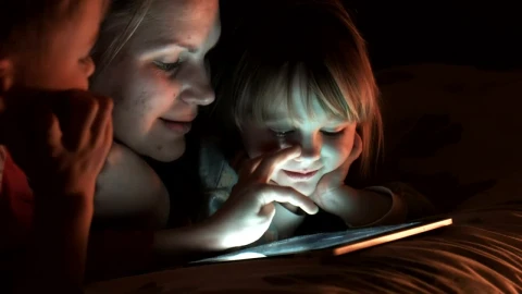 Stock Video Family Of Three Watching The Tablet In The Bedroom Live Wallpaper For PC - Free Live Wallpaper