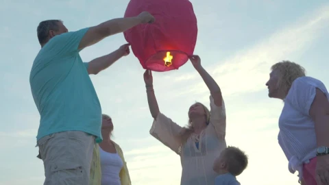 Stock Video Family Launching A Lantern Live Wallpaper For PC - Free Live Wallpaper