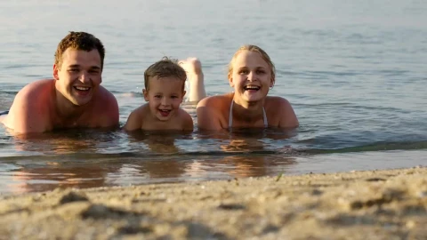 Stock Video Family Laughing While Laying In The Ocean Live Wallpaper For PC - Free Live Wallpaper