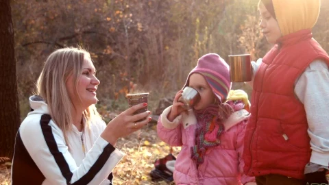 Stock Video Family Drinking A Hot Beverage In An Autumn Forest Live Wallpaper For PC - Free Live Wallpaper