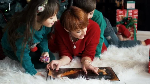 Stock Video Family Celebrates Christmas With Cuddle Near Tree Live Wallpaper For PC - Free Live Wallpaper