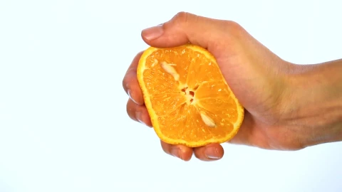 Stock Video Hand Of A Person Squeezing An Orange On A Light Live Wallpaper For PC - Free Live Wallpaper