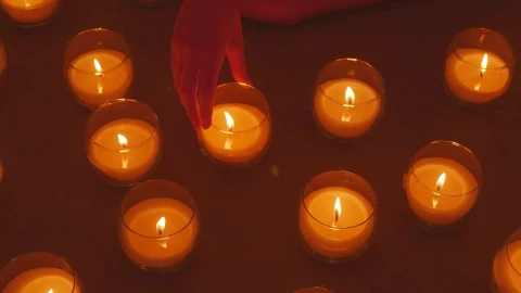 Stock Video Hand Of A Lady Arranging Burning Candles Live Wallpaper For PC - Free Live Wallpaper