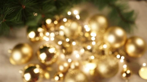 Stock Video Hand Holds Out Christmas Ornament With Gold Bokeh Background Live Wallpaper For PC - Free Live Wallpaper