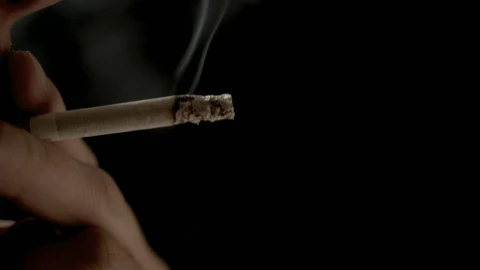 Stock Video Hand Holding Cigarette With Exhaled Smoke On Black Background Live Wallpaper For PC - Free Live Wallpaper
