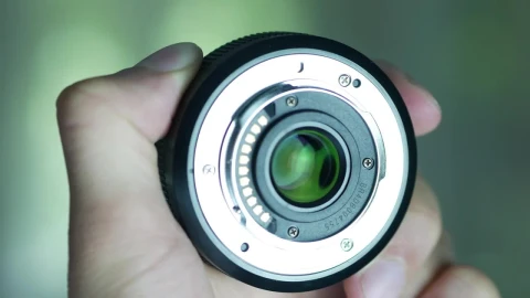 Stock Video Hand Holding A Camera Lens Live Wallpaper For PC - Free Live Wallpaper