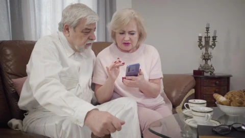 Stock Video Grandmother Teaches Her Husband How To Use A Phone Live Wallpaper For PC - Free Live Wallpaper
