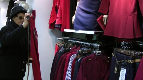 Stock Video Grandmother Shopping In A Clothing Store Live Wallpaper For PC - Free Live Wallpaper