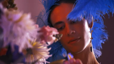 Stock Video Gay Man Dressed Feminine Appreciating Flowers Live Wallpaper For PC - Free Live Wallpaper