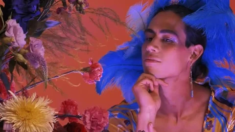 Stock Video Gay Boy Dressed And Made Up Extravagantly Among Flowers Live Wallpaper For PC - Free Live Wallpaper