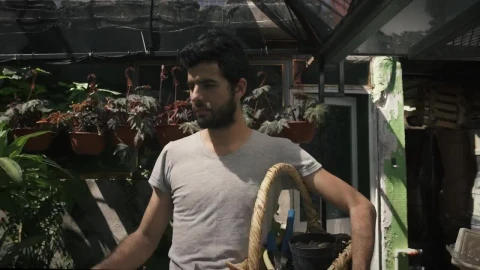 Stock Video Gardener Walking Through A Nursery Live Wallpaper For PC - Free Live Wallpaper