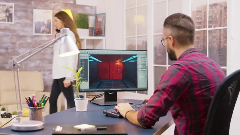 Stock Video Game Developer Working From Home Viewed From Behind Live Wallpaper For PC - Free Live Wallpaper