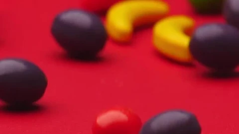 Stock Video Fruit Shaped Sweets Rolling On A Red Surface Live Wallpaper For PC - Free Live Wallpaper