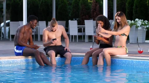 Stock Video Friends With Cell Phones Sitting On A Swimming Pool Live Wallpaper For PC - Free Live Wallpaper