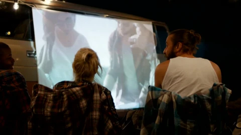 Stock Video Friends Watching A Movie At The Campsite Live Wallpaper For PC - Free Live Wallpaper