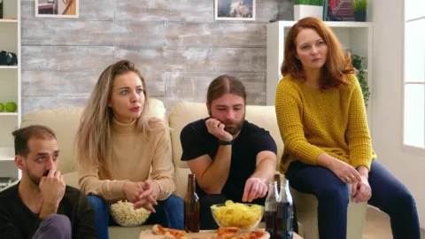 Stock Video Friends Show Fear While Watching Movie On Sofa With Pizza Live Wallpaper For PC - Free Live Wallpaper