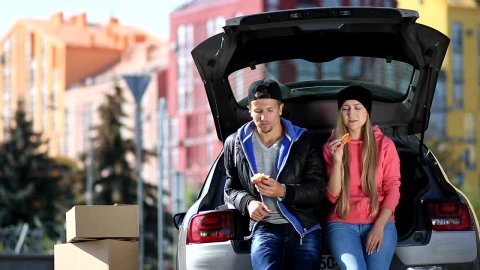Stock Video Friends Laughing And Eating Sitting In A Car Trunk Live Wallpaper For PC - Free Live Wallpaper