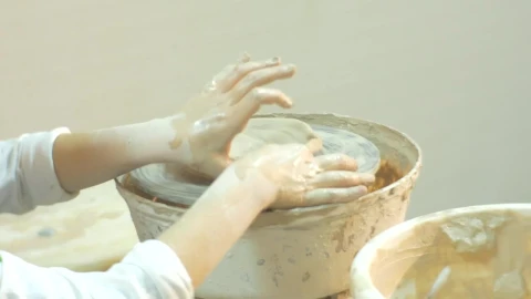 Stock Video Kid Working With Clay On A Pottery Wheel Animated Wallpaper - Free Live Wallpaper